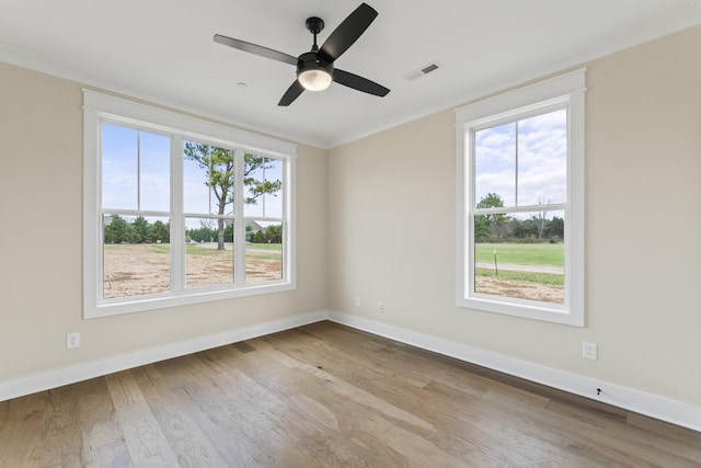 empty room with light hardwood / wood-style flooring and ceiling fan