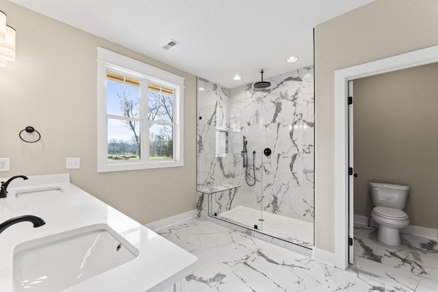 bathroom featuring toilet, sink, and a tile shower