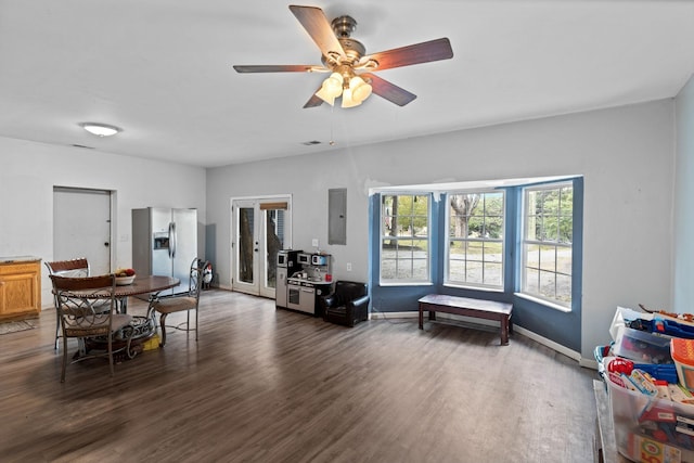 dining area with electric panel, dark hardwood / wood-style floors, and ceiling fan