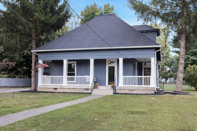 view of front facade with covered porch and a front lawn