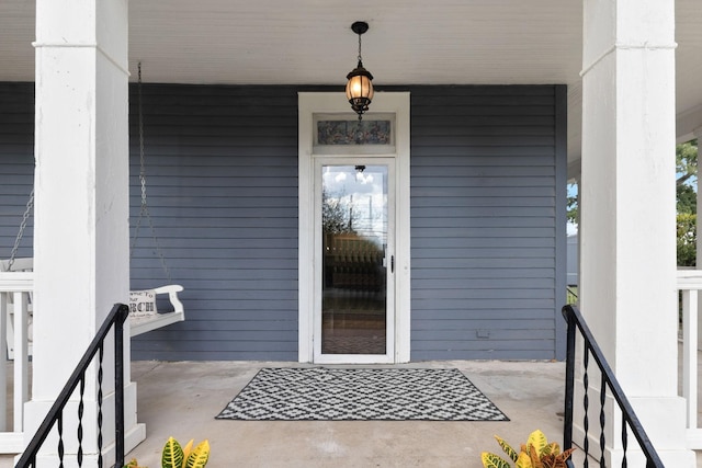 doorway to property with covered porch