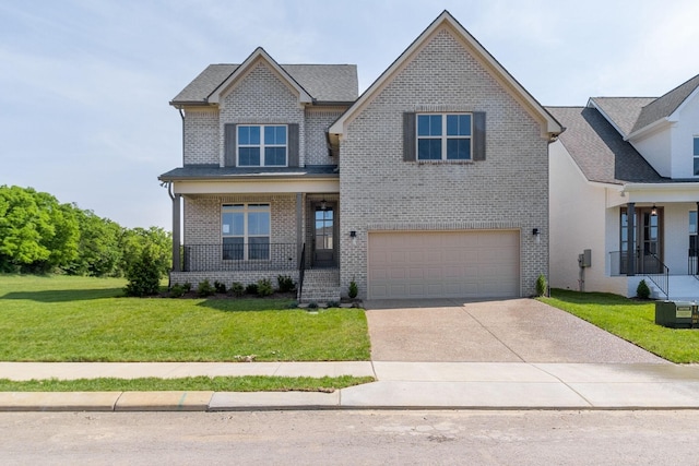 view of front of home featuring a front lawn, a porch, and a garage