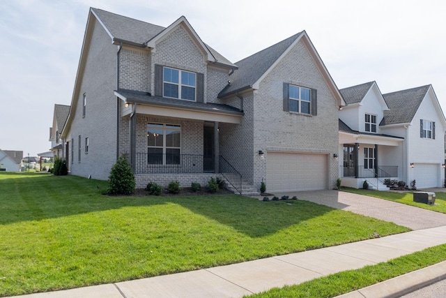 view of front of house featuring covered porch, a front yard, and a garage