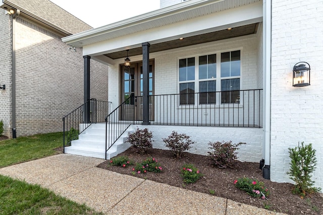 entrance to property with a porch