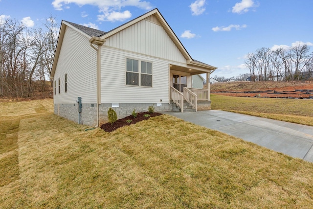 exterior space with covered porch and a lawn