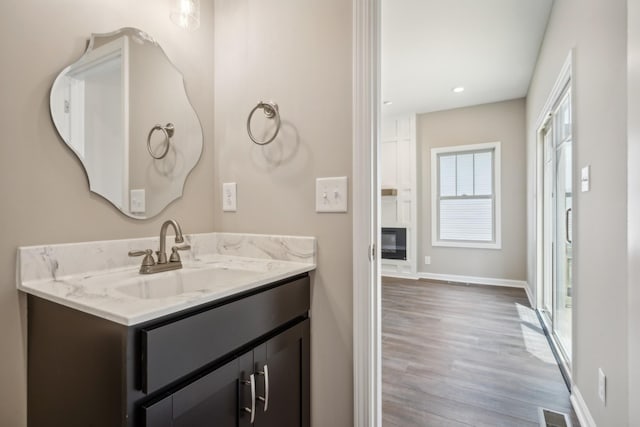 bathroom featuring hardwood / wood-style floors and vanity