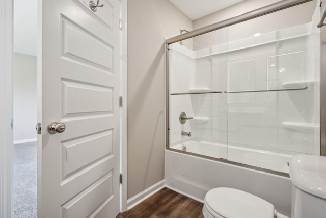 bathroom with shower / bath combination with glass door, toilet, and hardwood / wood-style flooring