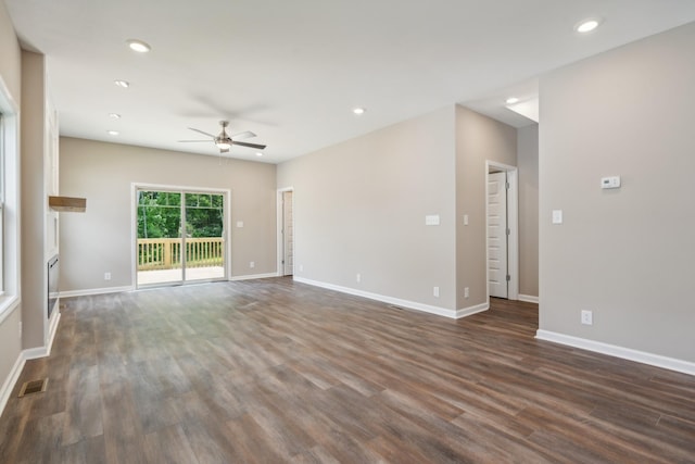 spare room with dark hardwood / wood-style floors and ceiling fan