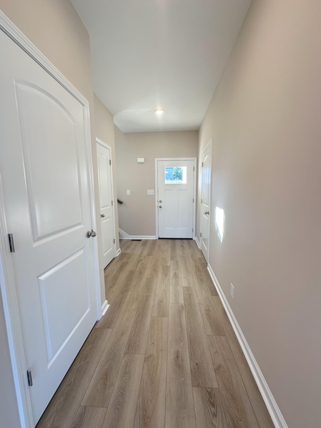 doorway with light hardwood / wood-style flooring