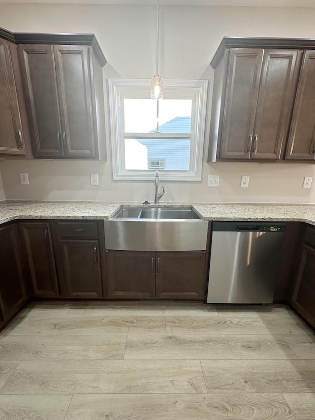 kitchen with dishwasher, dark brown cabinetry, sink, and light hardwood / wood-style flooring