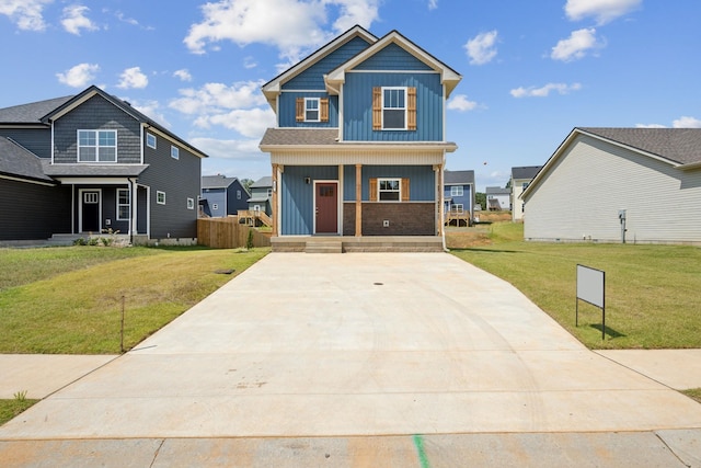 view of front of property with a porch and a front lawn