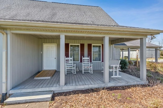 wooden terrace featuring covered porch