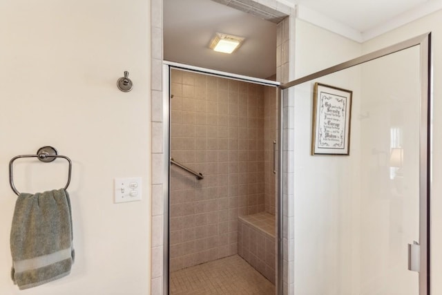 bathroom featuring a shower with door