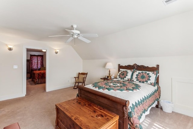 carpeted bedroom with ceiling fan and lofted ceiling