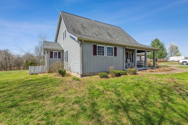 exterior space featuring a lawn and covered porch