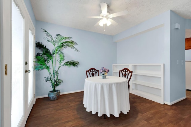 dining room featuring a textured ceiling, dark hardwood / wood-style floors, and ceiling fan