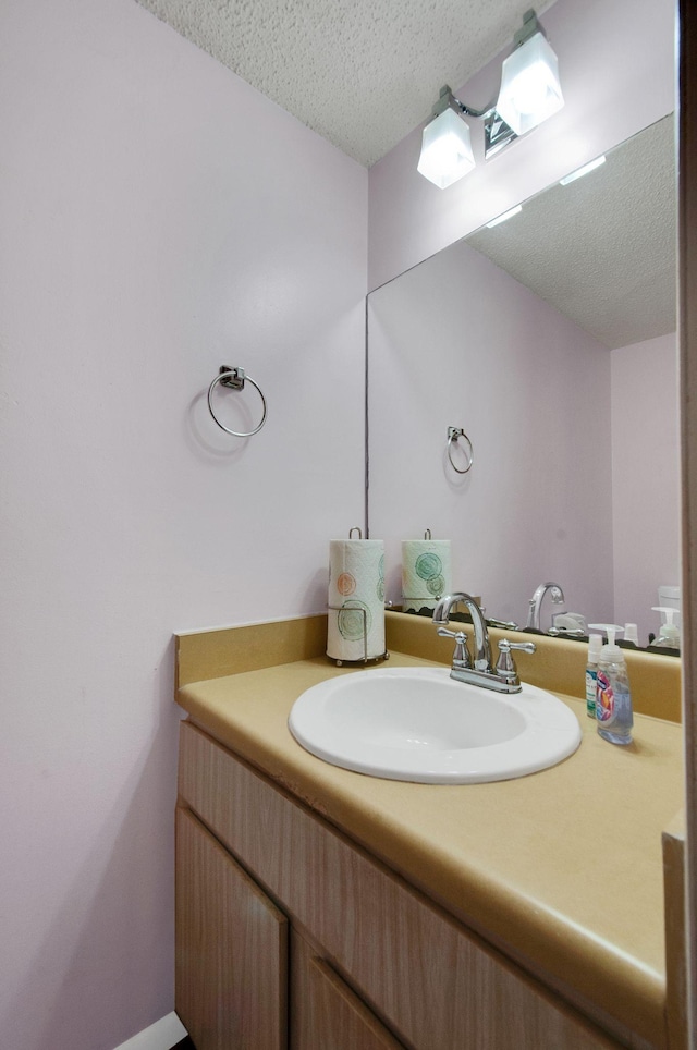 bathroom featuring vanity and a textured ceiling