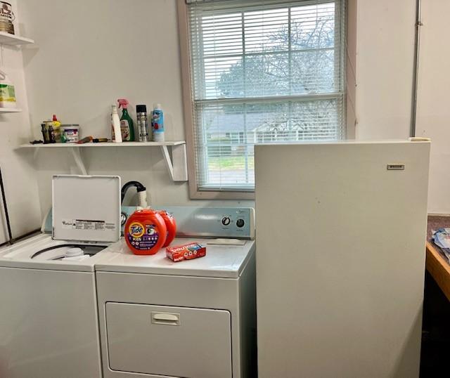 laundry room with washer and clothes dryer