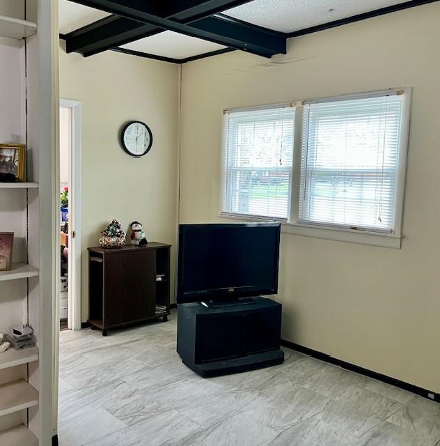 interior space featuring beam ceiling