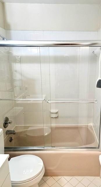 full bathroom with vanity, toilet, and bath / shower combo with glass door