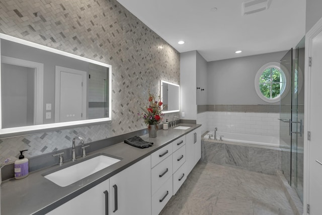 bathroom with vanity, tile patterned floors, and independent shower and bath