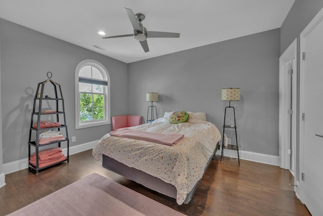 bedroom with ceiling fan and dark hardwood / wood-style flooring