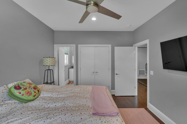 bedroom with a closet, ceiling fan, and dark hardwood / wood-style floors