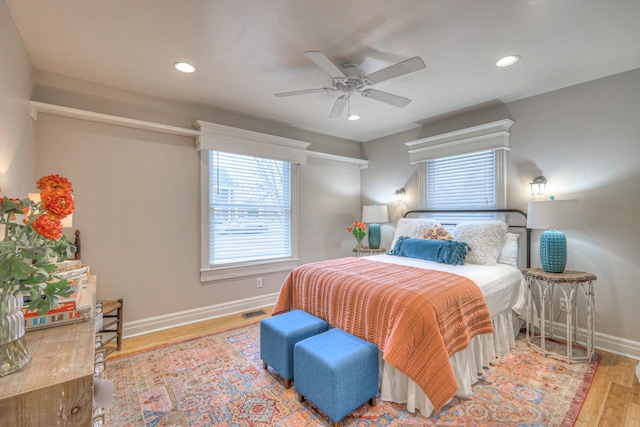 bedroom featuring ceiling fan and light hardwood / wood-style floors