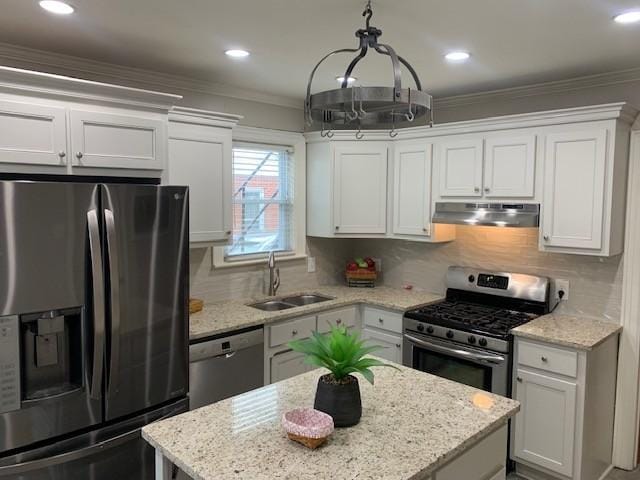 kitchen featuring ornamental molding, appliances with stainless steel finishes, sink, and white cabinets