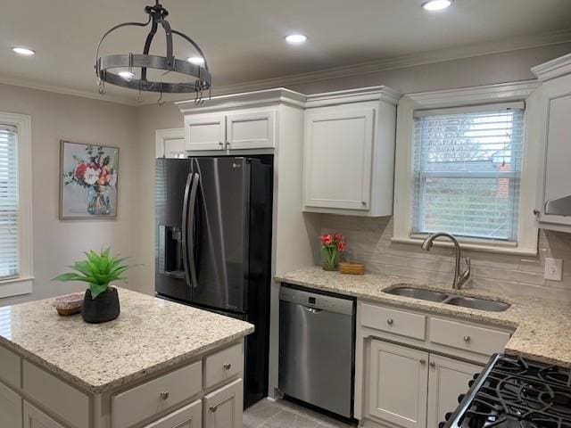 kitchen with white cabinetry, light stone countertops, sink, and stainless steel dishwasher