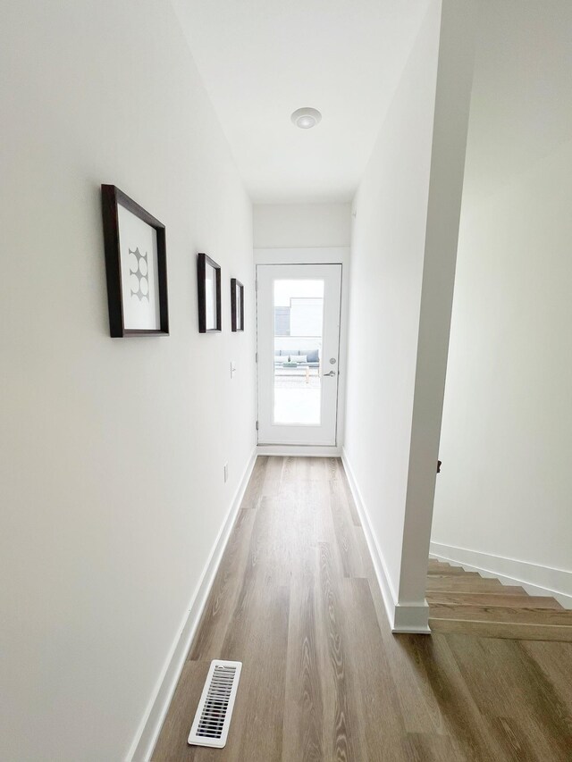 hallway featuring hardwood / wood-style floors