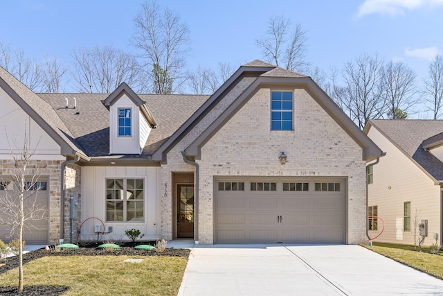 view of front of house featuring roof with shingles, brick siding, concrete driveway, board and batten siding, and a garage