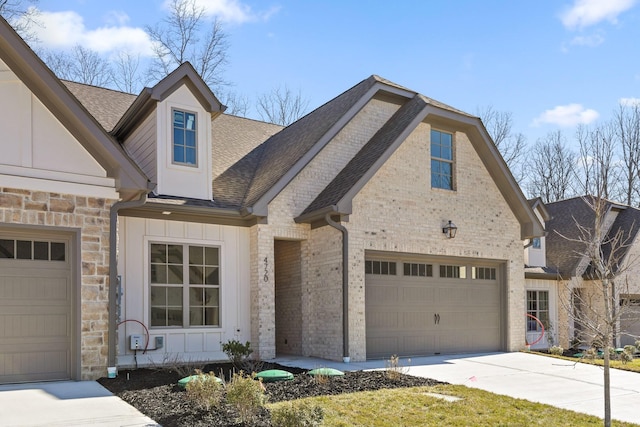 view of front facade featuring concrete driveway, brick siding, board and batten siding, and stone siding