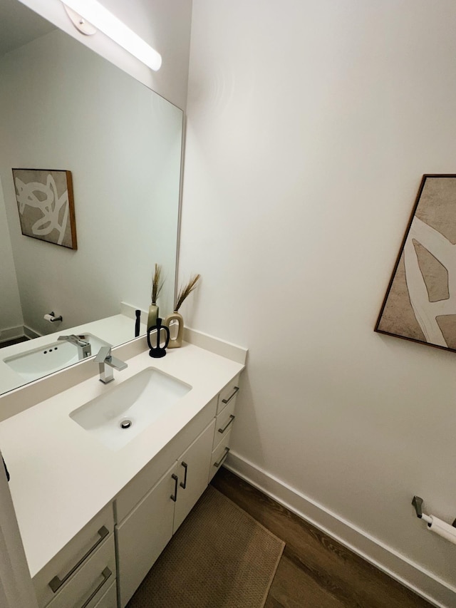 bathroom with vanity and wood-type flooring