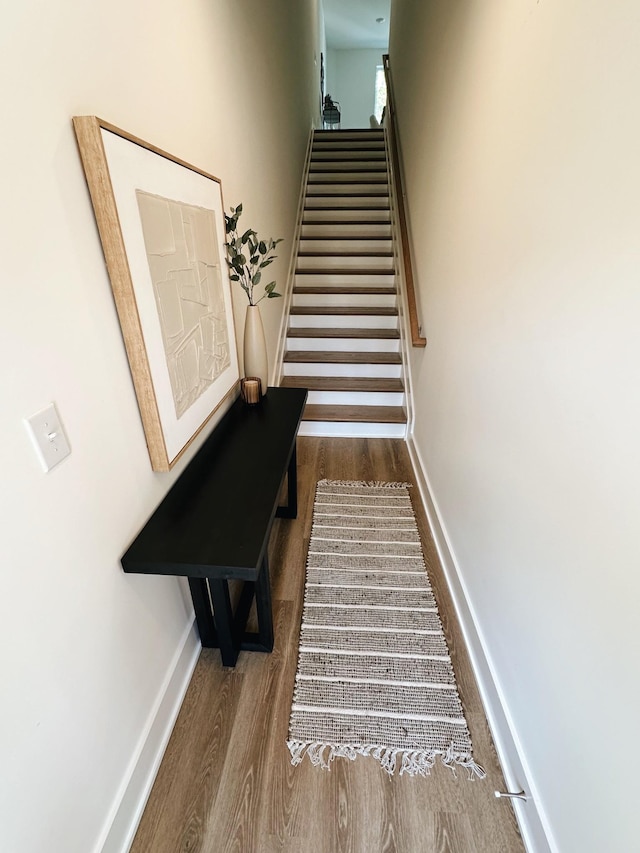 stairway with wood-type flooring