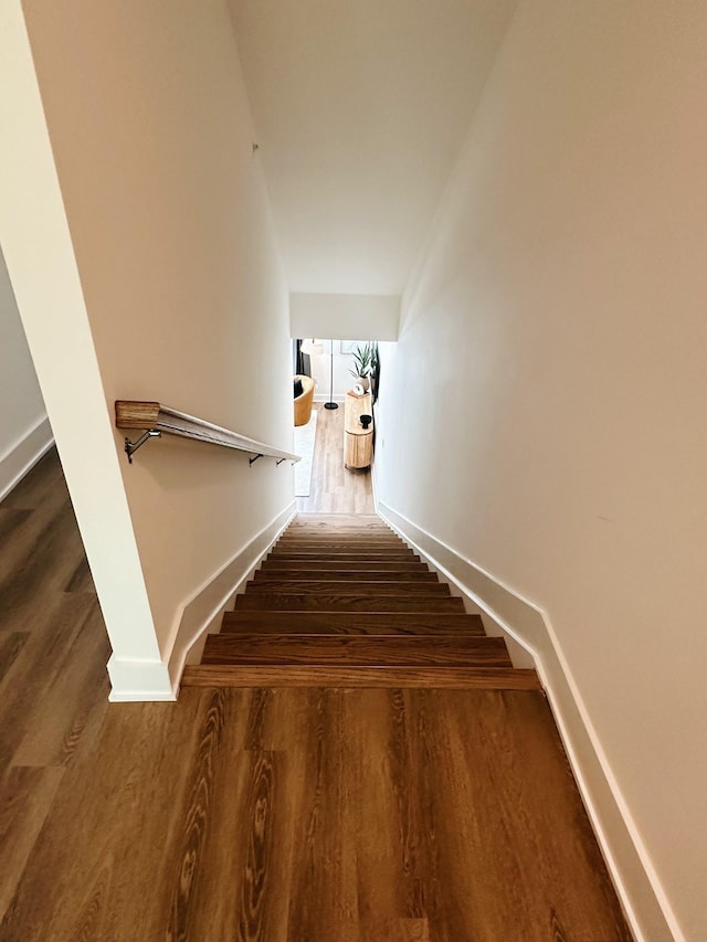 stairs with hardwood / wood-style floors