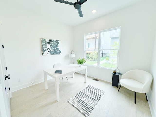 office featuring ceiling fan and light hardwood / wood-style floors