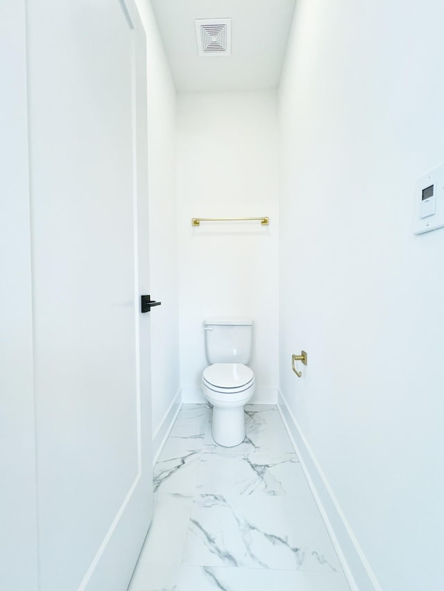 bathroom featuring toilet