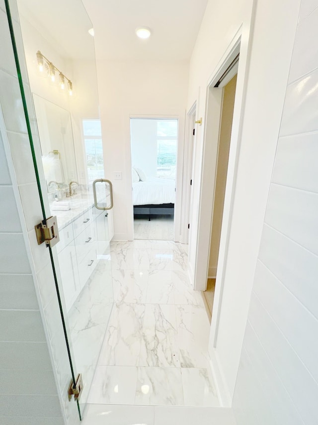 bathroom with plenty of natural light and vanity