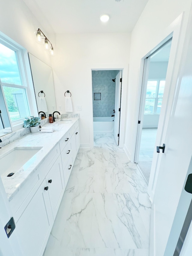 bathroom featuring vanity and a bathtub