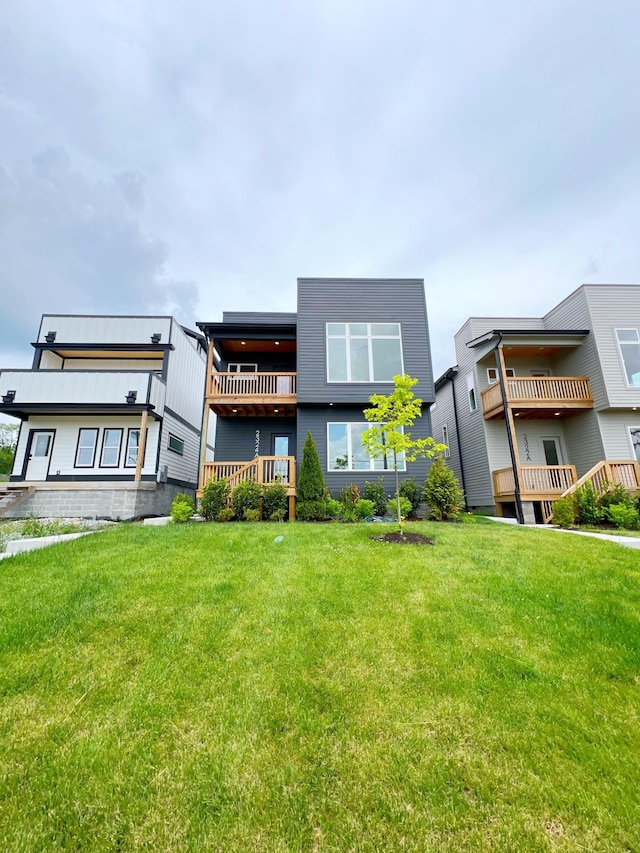 rear view of house with a yard