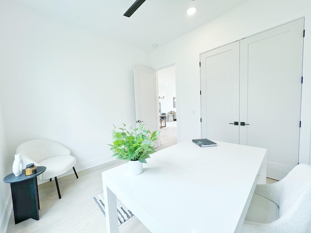 office with light hardwood / wood-style flooring