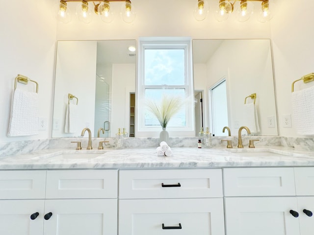 bathroom featuring vanity and walk in shower