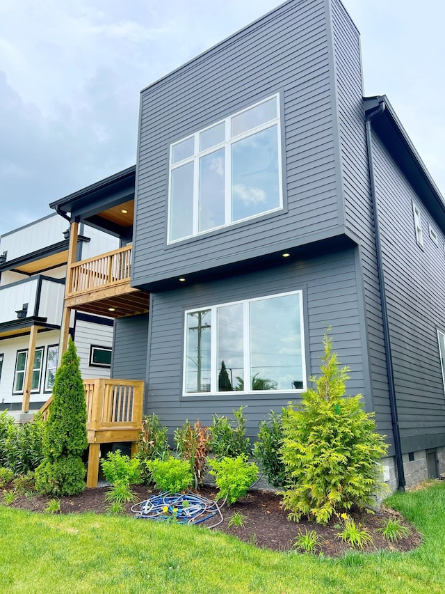 back of house with a balcony