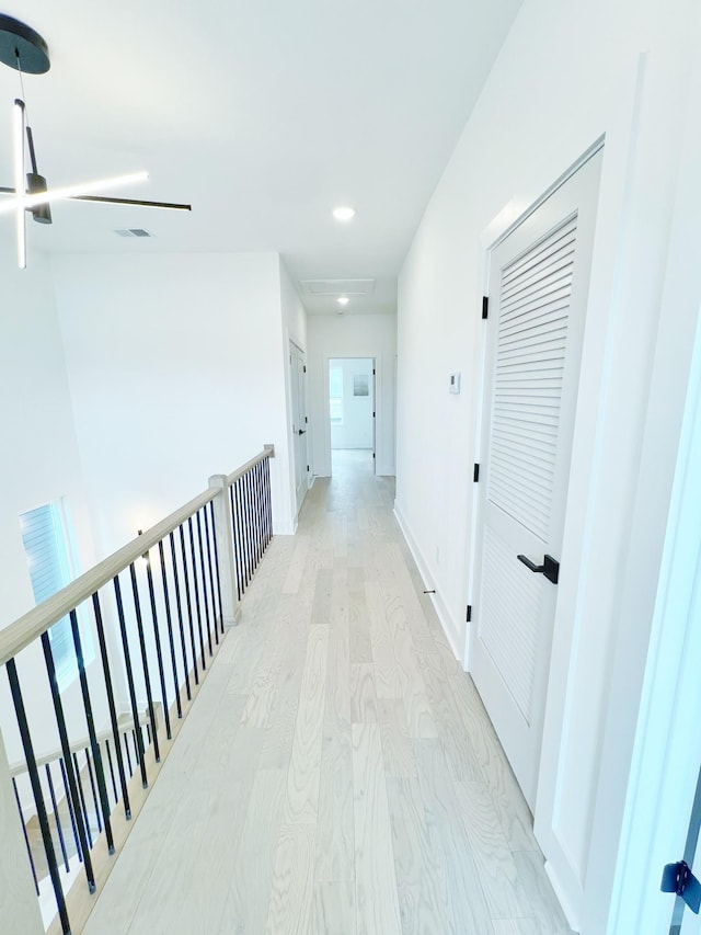 hall with light hardwood / wood-style flooring