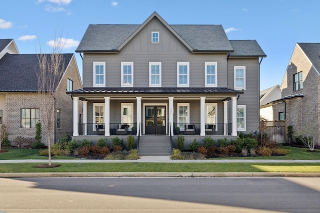 view of front of property featuring a porch and a front lawn