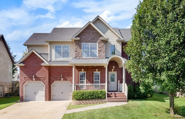 view of front of property with a garage and a front yard