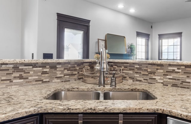 room details featuring backsplash and sink