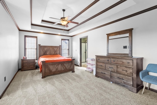 carpeted bedroom featuring ceiling fan, a raised ceiling, and ornamental molding