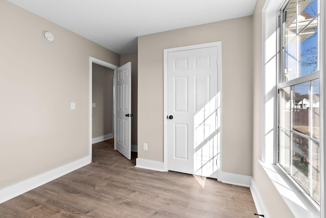 unfurnished room featuring light wood-type flooring